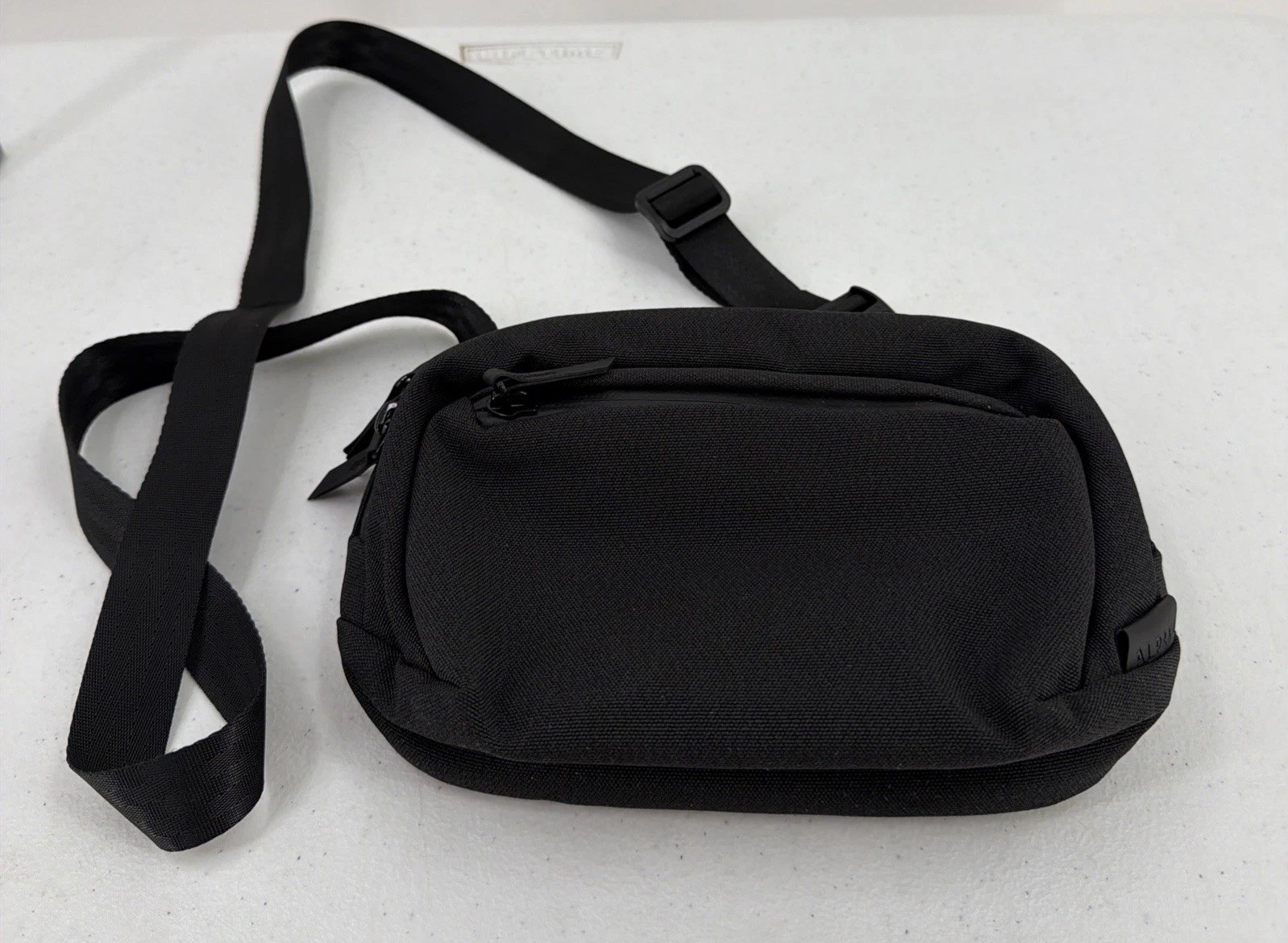 Alpaka Sling Bag Black Pockets Zip Adjustable Clean