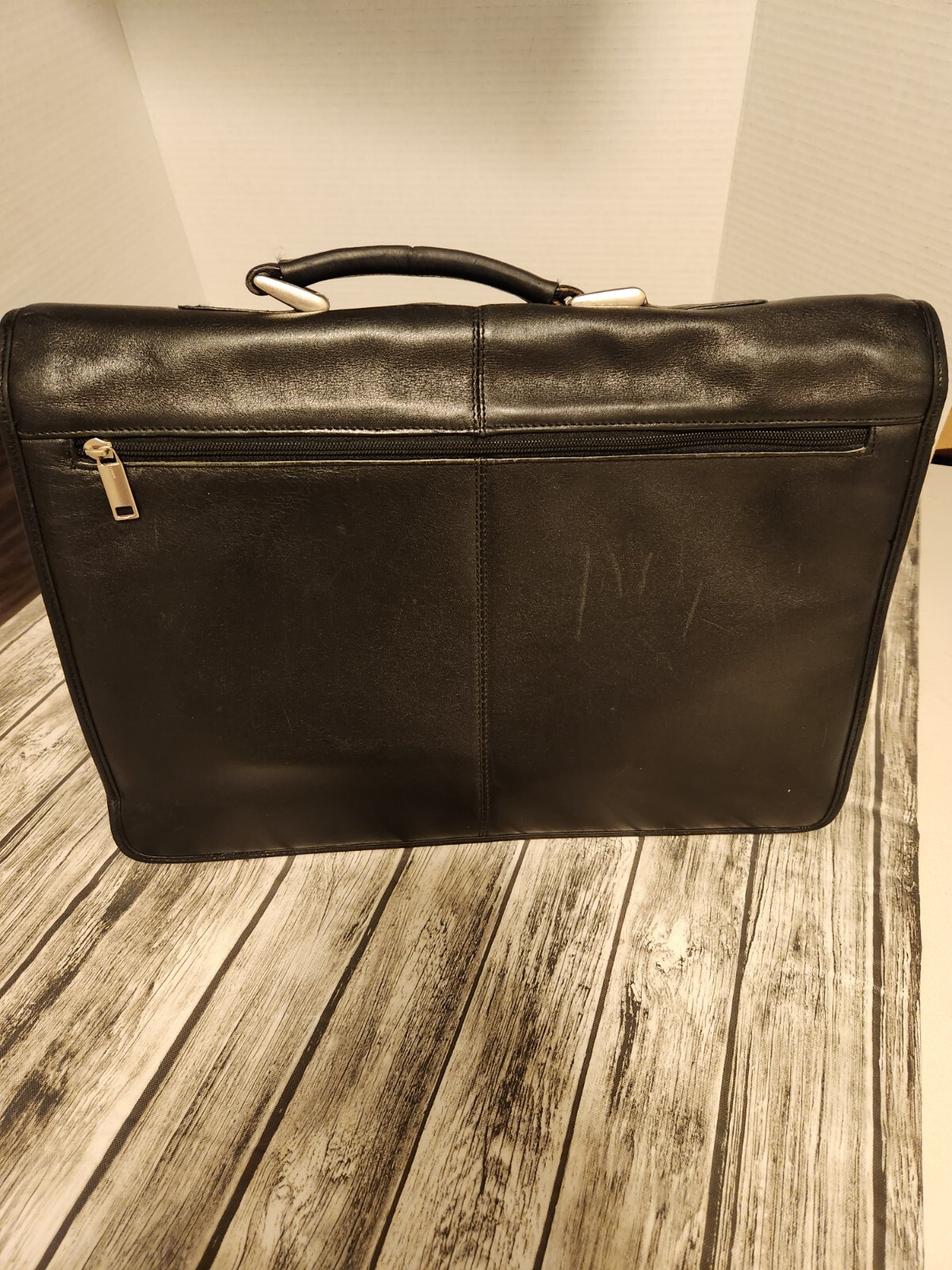 Black leather briefcase. Soft, Expands. W/ shoulder Strap