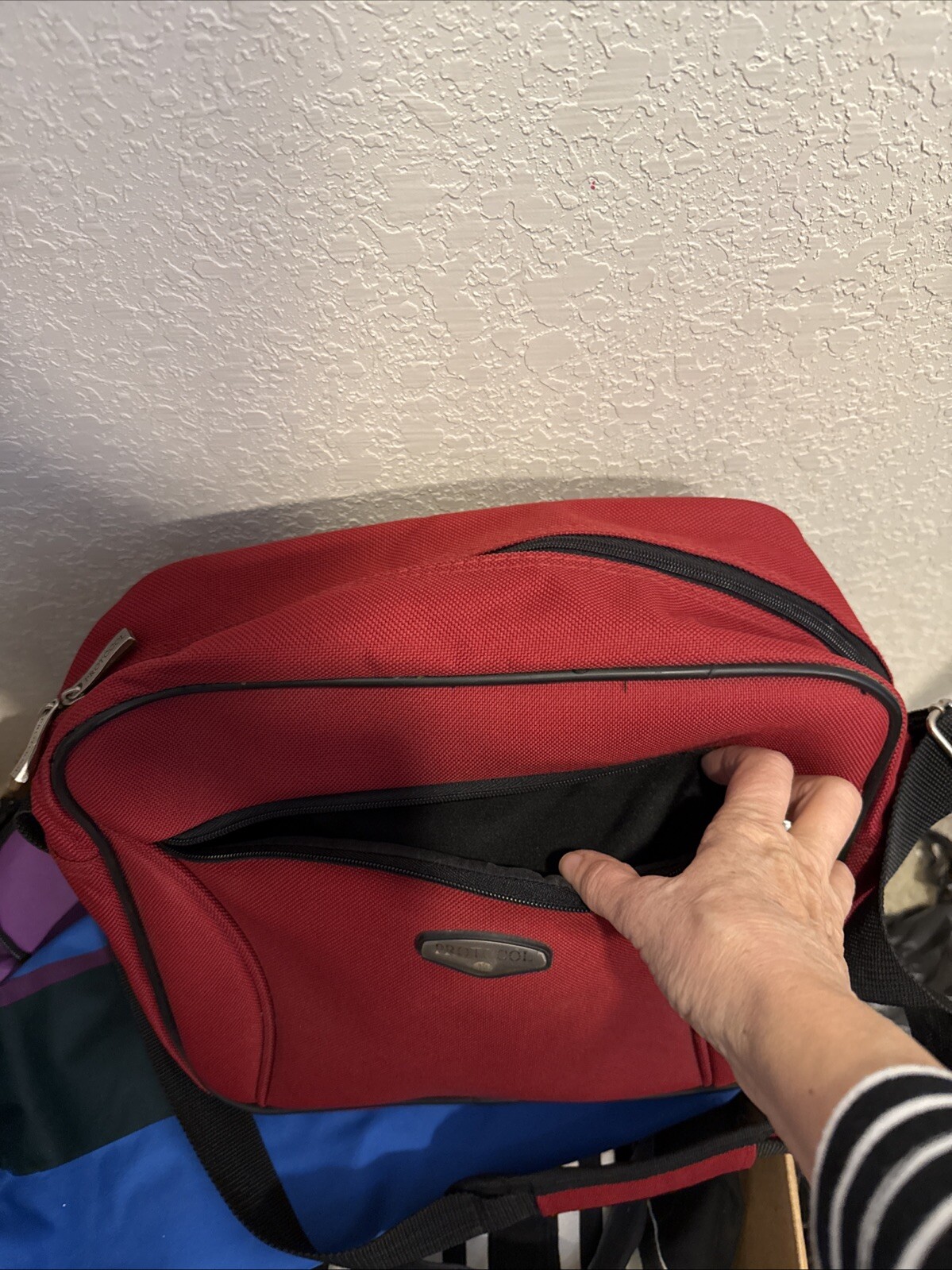 Protocol Messenger Bag Red 10in x 12in x 6in water resistant crossbody strap